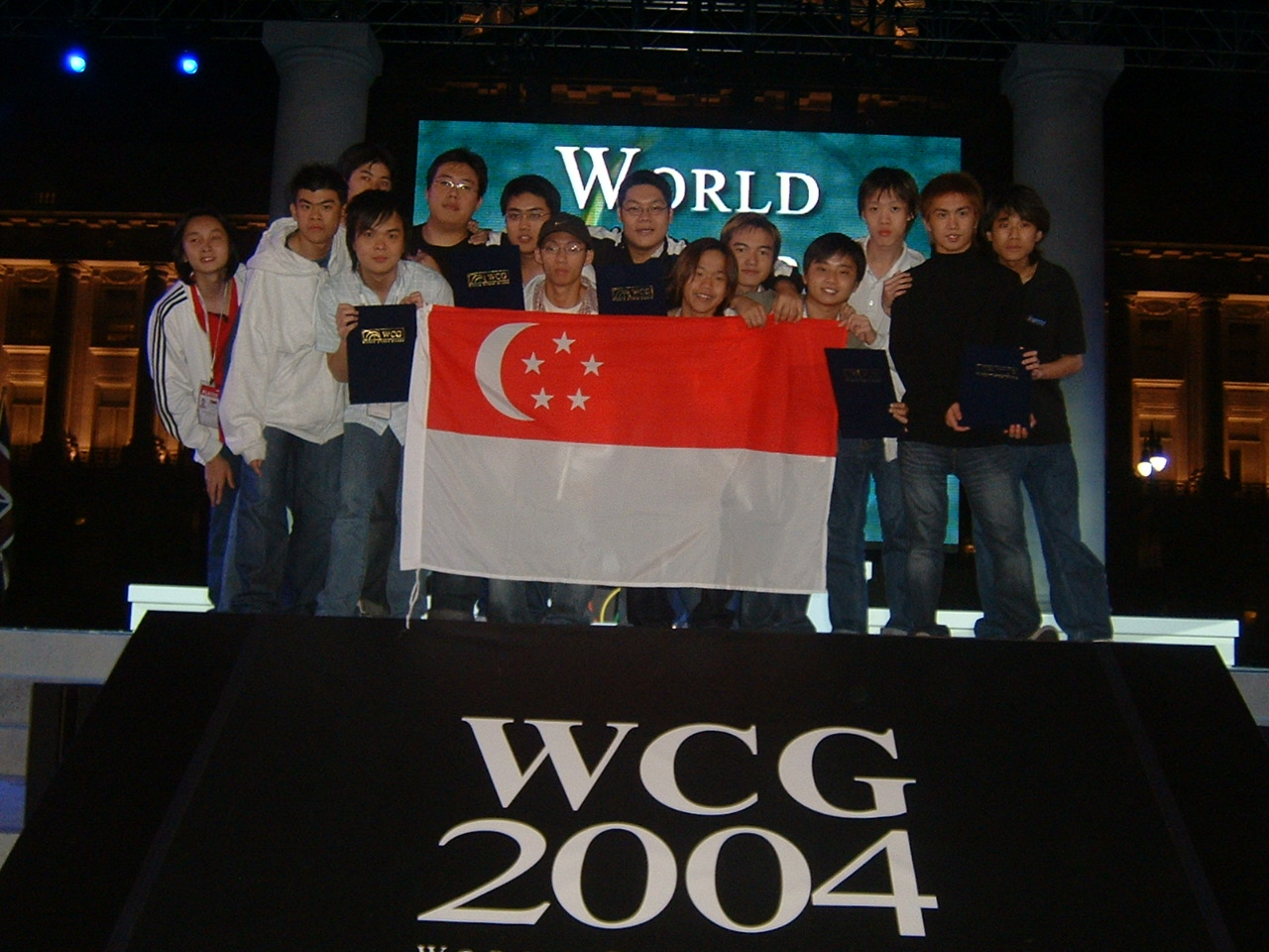 GBR members holding the Singapore flag at WCG 2004.