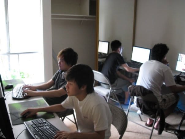 Kazuya seated at a gaming station.