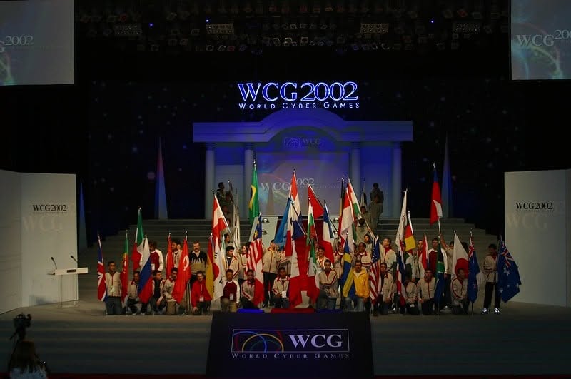 WCG 2002 stage in Korea with international flags and participants.